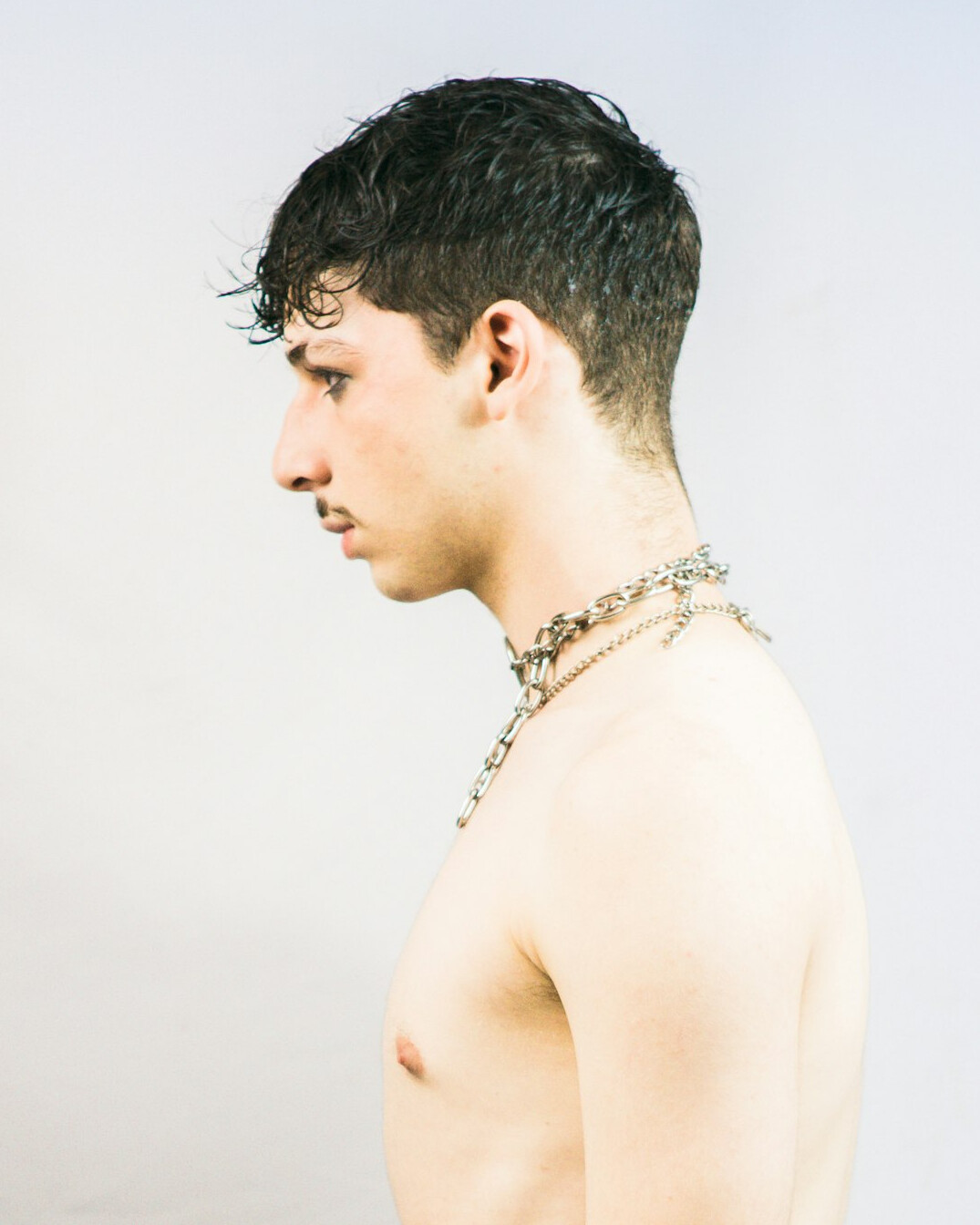 Studio portrait of a young man with short hair